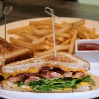 Grilled Cheese Sandwich · Grilled cheese- aged cheddar, goat cheese, bacon, tomato, baby arugula.