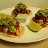 Fish Tacos · pan seared tilapia, pickled cabbage slaw, guacamole,  lime