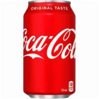 Coke · 12 oz. can.