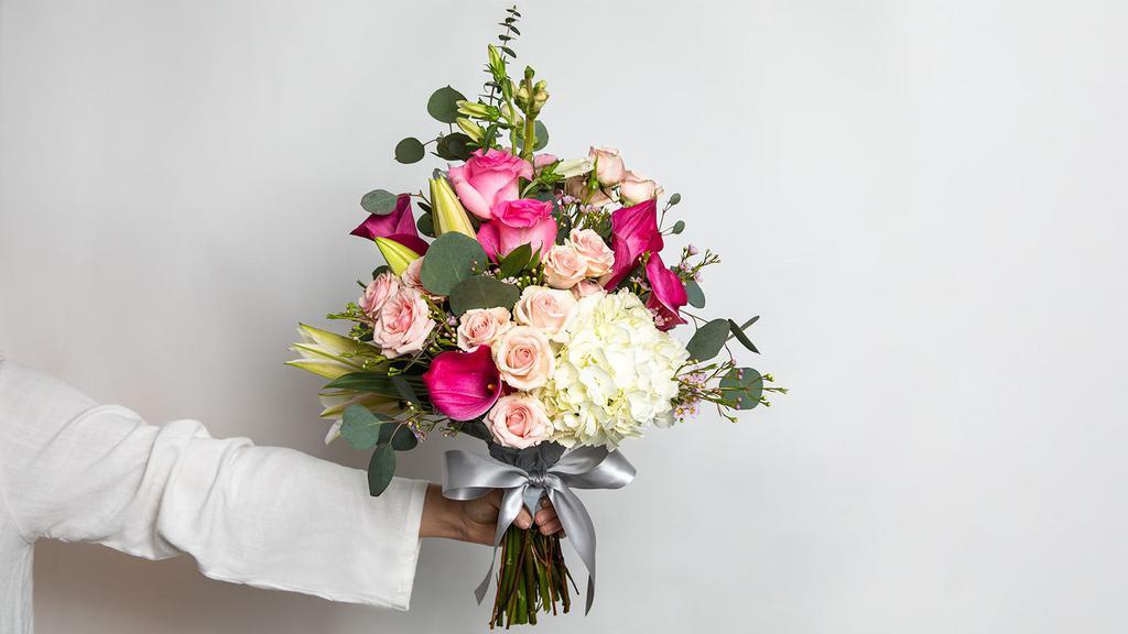 Pleasantly Pink Large Bouquet · Roses, mini callas, spray roses, lilies, campanula, hydrangeas, fillers and greens.