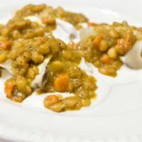Vegetarian Mantwo · Homemade pastry shell filled with onions topped with carrots yellow split-peas served with m...