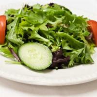 Salata · Mixed green salad served with balsamic vinaigrette or pomegranate dressing.