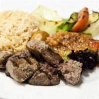 Seek Kabab · Charbroiled leg-of-lamb marinated in a puree of garlic, onions, and sumac. Served with sauté...