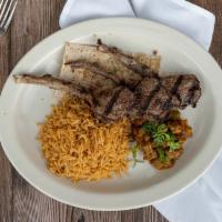 Chowpan · Half rack of grilled lamb served on a bed of afghan bread with sautéed eggplant and pallow r...