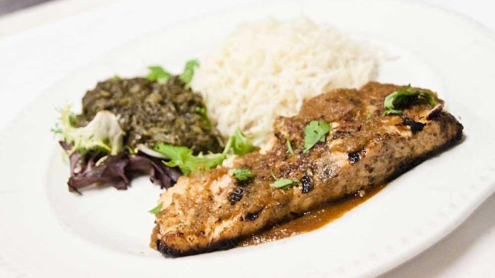 Salmon Kabab · Fresh-grilled salmon served with sautéed spinach and challow rice.
