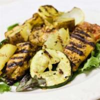 Mourgh Salata · Grilled chicken breast served on a mixed green salad with grilled vegetables and a vinaigret...