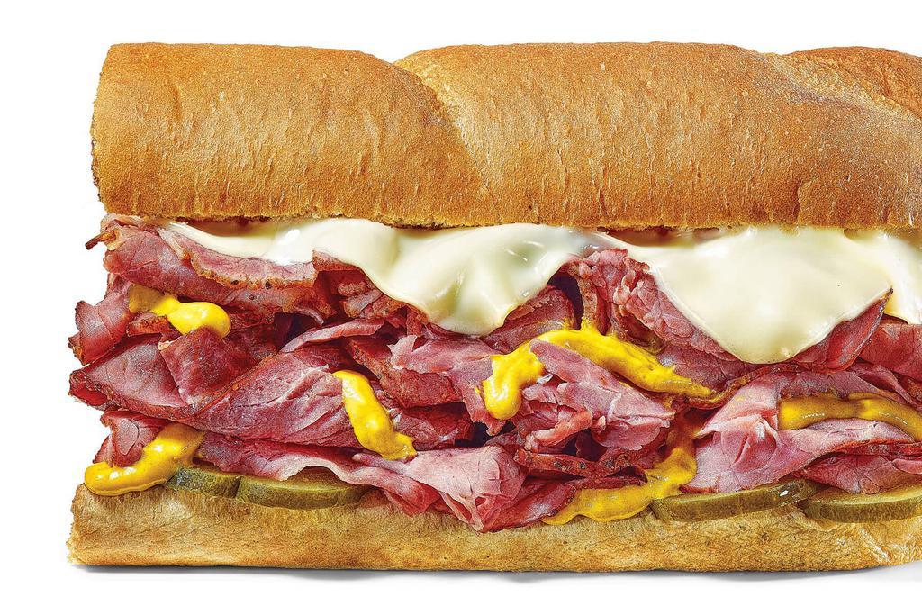 Big Hot Pastrami · A monument to flavor loaded with cuts of dry-rubbed, pepper-crusted beef and melted cheese on freshly baked bread. Enjoy yours with mustard and pickles.