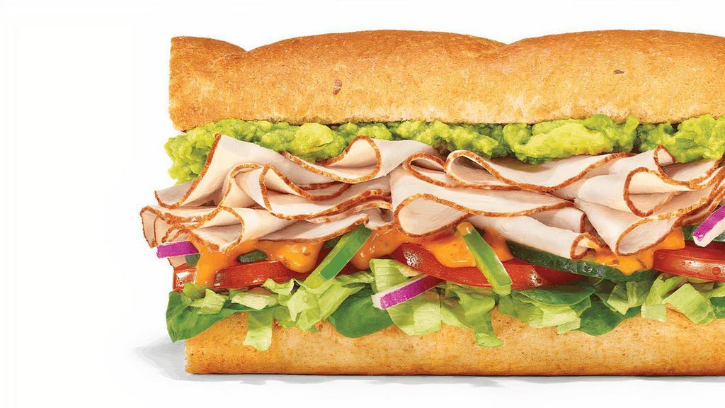 Baja Turkey Avocado · Oven-Roasted Turkey, Smashed Avocado, and crisp veggies, topped with Baja Chipotle sauce: this one is all about that bold, smoky and spicy flavor!