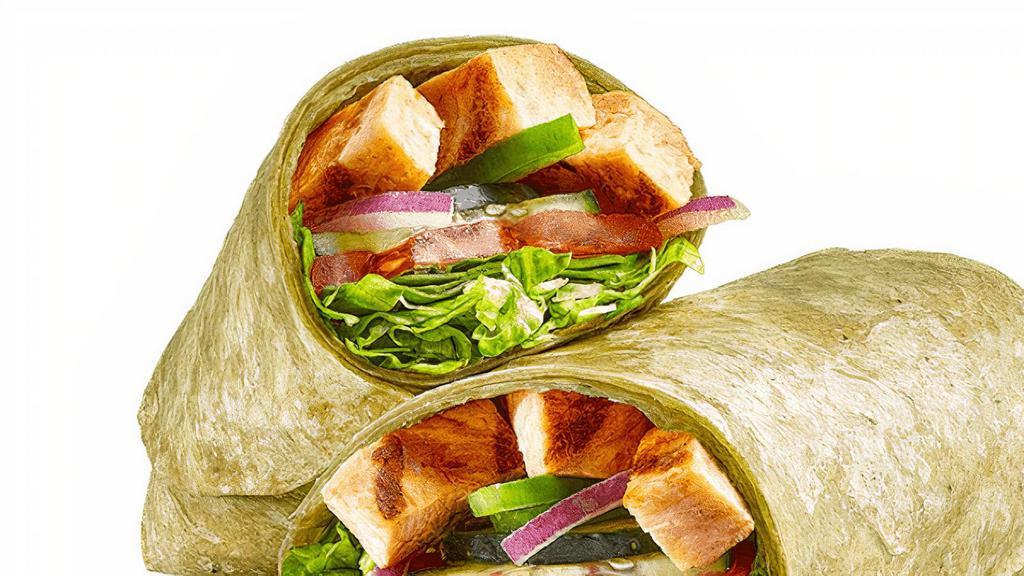 Grilled Chicken  (470 Cals) · When you want to be 100% satisfied, this wrap delivers. Tender grilled chicken, with fresh veggies like lettuce, baby spinach, tomatoes, cucumbers, green peppers and red onions in a spinach wrap.