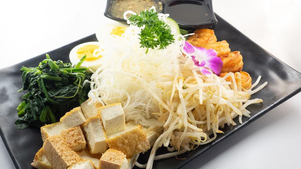Thai Vermicelli Salad · Spicy. This light and fresh salad filled with vermicelli noodle, crispy shrimps, fried tofu, cucumbers, spinach, bean sprouts, boiled egg, carrots, served with house sweet n' tangy dressing.