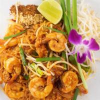 Pad Thai · Gluten free. Rice noodles sautéed with eggs, tofu, bean sprouts, chives and roasted ground p...