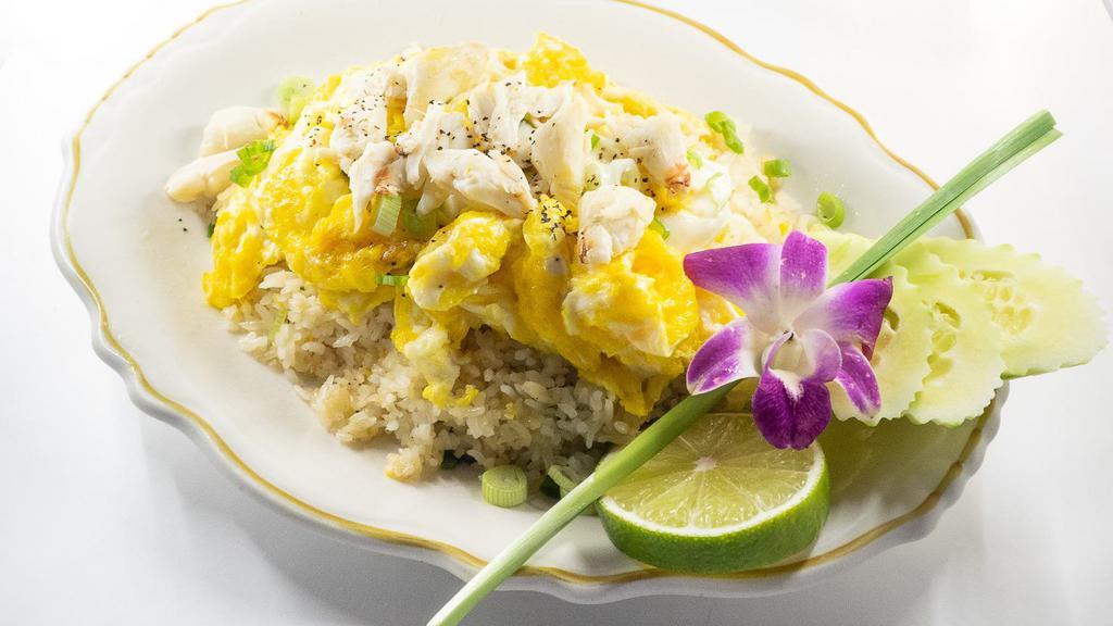 Crab Fried Rice · Home style fried rice with Crab Meat, eggs, garlic, and green onions.