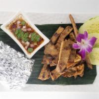 BBQ PORK · Marinated Pork with a variety of herbs, served with House Salad, Steamed Sticky Rice, and Sp...