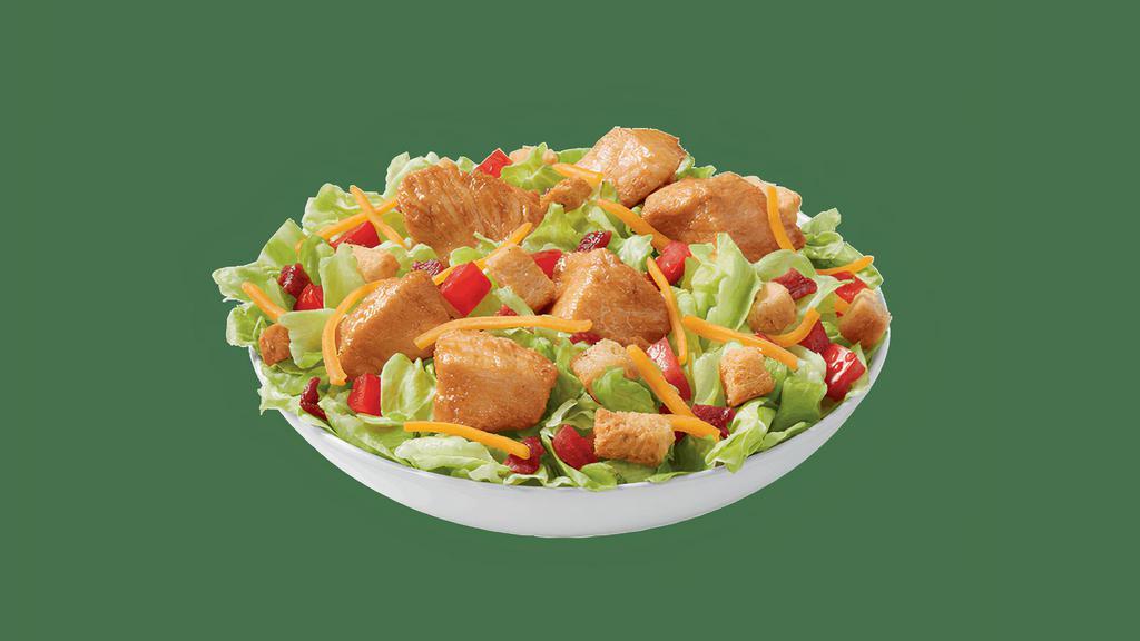Rotisserie-Style Chicken Bites Salad Bowl · DQ’s new 100% white meat, juicy, tender, rotisserie-style chicken bites, served on top of a crispy bed of lettuce, diced tomatoes, bacon, and shredded cheddar. Served with house-made Hidden Valley Ranch, or your choice of dressing. .