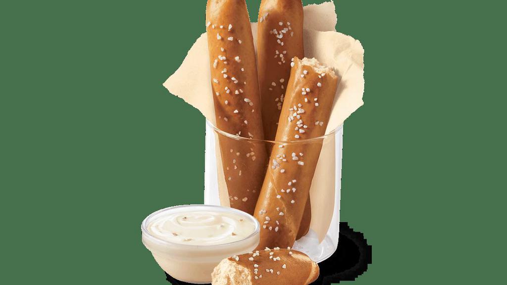 Pretzel Sticks With Zesty Queso · Soft pretzel sticks, served hot from the oven, topped with salt and served with warm zesty queso dipping sauce.