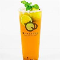 Passion Cooler · Passion fruit green tea with kumquat juice, limes and mint.