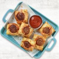 Meatball Dunkers · A bite of an all-beef meatball wrapped in our house-made dough with a touch of marinara sauc...
