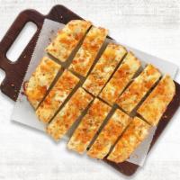New Shareable Cheesy Bread · Our house-made dough brushed with garlic butter and layer on mozzarella & cheddar cheese, an...