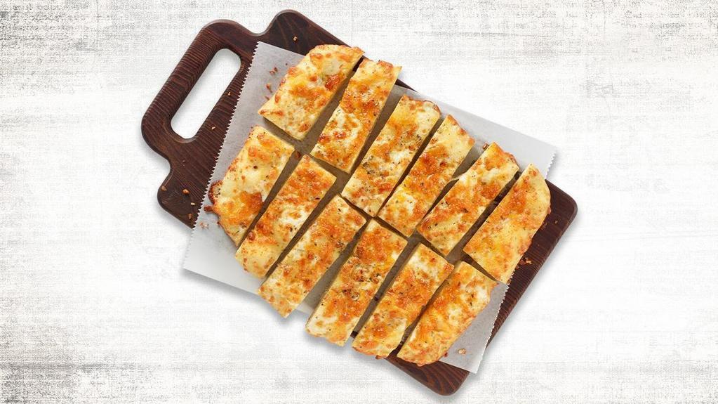New Shareable Cheesy Bread · Our house-made dough brushed with garlic butter and layer on mozzarella & cheddar cheese, and we sprinkle it with our Italian seasoning and served with your choice of sauce.  (Sauce options: Marinara or Ranch)