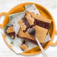 Brookie · A delicious marriage of a fudgy brownie and a chocolate chip cookie.  An indulgent serving t...