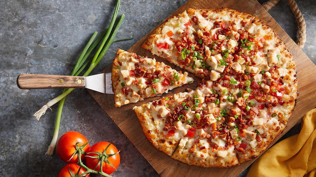 The Supreme Chicken · White sauce, cheese, chicken, bacon, diced tomatoes and green onions.