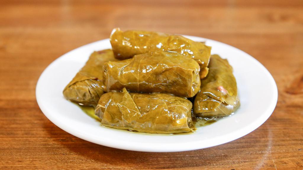 Dolmeh · Stuffed grape leaves filled with rice and fresh herbs. 8 pieces.