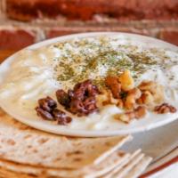 Mast o Khiar · Persian cucumber, yogurt, raisins, walnuts and lavash bread.