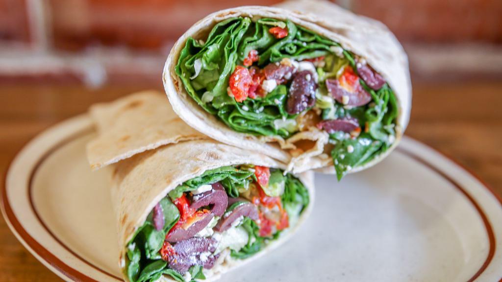 Mediterranean Wrap · Romaine lettuce, spinach, mozzarella pearls, sundried tomatoes, kalamata olives and feta cheese tossed in olive oil.