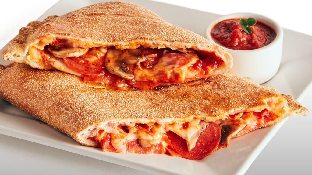 Calzone · Our original crust, filled with homemade red tomato sauce, mozzarella cheese, and your choice of two toppings.