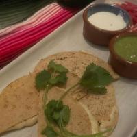 Queso Quesadilla · heirloom Oaxacan corn tortillas, Chihuahua cheese. (vegetarian)