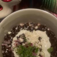 Frijoles Negros · heirloom black beans, red onions, crema, queso fresco (GF, vegetarian)