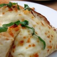 Garlic Bread · Warm house made bread topped with a blend of butter, garlic and melted mozzarella, served wi...