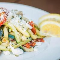 Zoodle Salad · Seasoned ribbons of zucchini tossed with fire roasted tomatoes, artichoke hearts, Kalamata o...