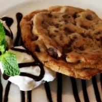 Chocolate Chip Cookie Dessert · Delicious chocolate chip cookie served with vanilla bean gelato & Ghiradelli chocolate sauce...