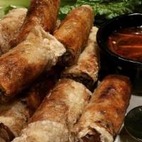 Imperial Rolls · Crispy rolls filled with pork, taro, carrots, and silver noodles.
