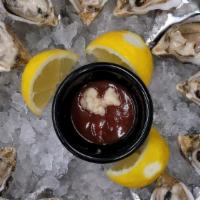 Fresh Oysters · Fresh oysters on the half shell with cocktail sauce