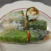 Veggie Rolls · Soft rice paper rolls with sautéed vegetables and tofu.