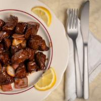 Beef Steak Cubes · Tender beef cubes sautéed with onions and a vinaigrette.