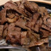 Sizzling Charbroiled Pork · Thinly sliced pork loins marinated in lemongrass.