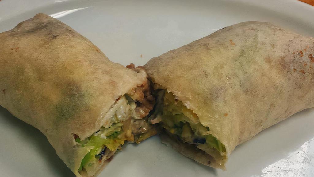 Vegetarian Burrito · Filled with rice, your choice of beans, homemade guacamole, sour cream and monterrey cheese