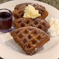 Churro Waffle · Our house made waffle deep fried and coated in cinnamon sugar. Sprinkled with powdered sugar...