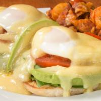 Vegetarian Benedict · Fresh grilled spinach, grilled tomatoes, and avocado on an English muffin topped with poache...