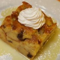 Bread Pudding with Whiskey Sauce · Tender egg bread and raisins soaked in a rich cinnamon cream mixture and baked until golden ...