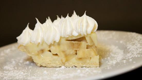 Banana Cream Pie · Fresh bananas sandwiched between layers of creamy housemade pudding. Topped with whipped cream.