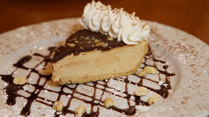 Peanut Buttercup Pie · A delectable, rich peanut butter mousse, topped with a layer of chocolate and a sprinkling of chopped peanuts.