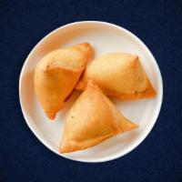Vegetable Samosa/ 2 pieces · Idaho potatoes mixed in a curry marinate & fried in a crispy wheat layer. Served with tamari...
