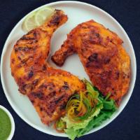 Tandoori Chicken Boti Boneless · Chicken pieces marinated with tandoori spices and baked in a clay oven.