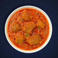 Lamb Curry · Lamb cooked in a tomato based onion gravy with freshly ground spices.