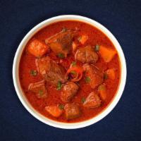 Lamb Vindaloo · Juice lamb cooked in a spicy pungent curry with potatoes.
