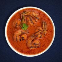 Prawns Masala · Jumbo prawns  cooked in a tomato based onion gravy with ground spices.